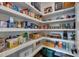 Walk-in pantry with custom shelving, ideal for organized storage at 14 Duck Bill Trl, Pittsboro, NC 27312