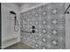 Close-up of the shower featuring decorative tile and matte black shower fixture at 14 Duck Bill Trl, Pittsboro, NC 27312