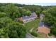 Aerial view of a townhome community surrounded by lush green trees at 145 Coleridge Ct, Carrboro, NC 27510