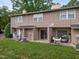 Cozy townhome featuring a back patio perfect for relaxation with a small lawn at 145 Coleridge Ct, Carrboro, NC 27510