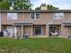 Charming townhome featuring a cozy back patio and green lawn at 145 Coleridge Ct, Carrboro, NC 27510