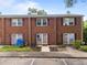 Charming brick townhomes with well-maintained landscaping and purple shutters provide a cozy curb appeal at 145 Coleridge Ct, Carrboro, NC 27510