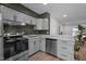 Modern kitchen with stainless appliances, granite countertops, and sleek cabinets at 145 Coleridge Ct, Carrboro, NC 27510