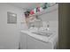 Convenient laundry room with modern washer and dryer units, and ample storage space at 145 Coleridge Ct, Carrboro, NC 27510