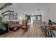 Bright living room boasts wood floors, modern decor, and an open layout to the kitchen at 145 Coleridge Ct, Carrboro, NC 27510
