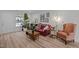 Bright living room boasts wood floors, modern decor, and a comfortable seating area at 145 Coleridge Ct, Carrboro, NC 27510