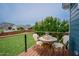 Outdoor deck with table and chairs overlooking a lush green backyard at 2020 Cotton Barn Ct, Wendell, NC 27591