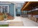 Inviting back patio featuring a pergola, hot tub, and comfortable seating area at 2020 Cotton Barn Ct, Wendell, NC 27591
