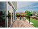 Inviting back porch with comfortable seating, pergola, and a beautifully landscaped backyard at 2020 Cotton Barn Ct, Wendell, NC 27591