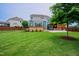 Expansive backyard featuring an outdoor entertaining area and lush greenery at 2020 Cotton Barn Ct, Wendell, NC 27591