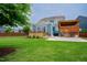 Spacious backyard featuring a wooden fence, an outdoor kitchen, and a patio at 2020 Cotton Barn Ct, Wendell, NC 27591