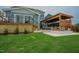 A lovely backyard space with a charming pergola, patio, and lush green lawn for relaxation and enjoyment at 2020 Cotton Barn Ct, Wendell, NC 27591