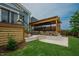 Stunning backyard with a pergola-covered seating area, a hot tub, and well-manicured lawn at 2020 Cotton Barn Ct, Wendell, NC 27591