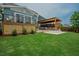 Beautiful backyard featuring a covered patio and well-manicured lawn, perfect for outdoor living and entertaining at 2020 Cotton Barn Ct, Wendell, NC 27591