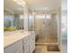 Bathroom featuring a double vanity, tile shower, and neutral decor at 2020 Cotton Barn Ct, Wendell, NC 27591