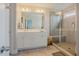 Bathroom featuring a double vanity, tile shower, and tile floors at 2020 Cotton Barn Ct, Wendell, NC 27591