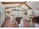 Bright dining room with vaulted ceilings, wood beams, and views of the backyard at 2020 Cotton Barn Ct, Wendell, NC 27591