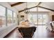 Bright dining room with vaulted ceilings, wood beams, and sliding door at 2020 Cotton Barn Ct, Wendell, NC 27591