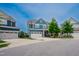 Beautiful two-story blue home featuring a two-car garage and well-maintained front yard at 2020 Cotton Barn Ct, Wendell, NC 27591