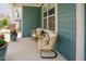 Cozy front porch with comfortable wicker chairs and a charming view at 2020 Cotton Barn Ct, Wendell, NC 27591