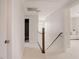 Bright upstairs hallway with carpeting and access to bedrooms and bathroom at 2020 Cotton Barn Ct, Wendell, NC 27591
