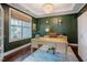 Stylish home office featuring hardwood floors, a modern chandelier, and ample natural light at 2020 Cotton Barn Ct, Wendell, NC 27591