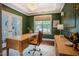 Sophisticated home office with dark green walls, an elegant chandelier, and a classic writing desk at 2020 Cotton Barn Ct, Wendell, NC 27591
