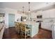 Modern kitchen with stainless appliances, a large island, and green cabinets at 2020 Cotton Barn Ct, Wendell, NC 27591