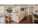 Inviting living room with hardwood floors, fireplace, large couch, and seamless flow at 2020 Cotton Barn Ct, Wendell, NC 27591