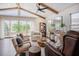Bright sitting area with vaulted ceilings, wood beams, and lots of natural light at 2020 Cotton Barn Ct, Wendell, NC 27591