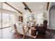 Sitting area with vaulted ceilings, wood beams, lots of natural light, and patio access at 2020 Cotton Barn Ct, Wendell, NC 27591