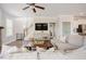Comfortable living room space with a large sectional sofa and wood-look flooring at 2020 Cotton Barn Ct, Wendell, NC 27591