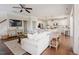 Cozy living room open to the kitchen, featuring a large sectional sofa at 2020 Cotton Barn Ct, Wendell, NC 27591