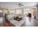 Open concept living room with hardwood floors, ceiling fan and ample natural light at 2020 Cotton Barn Ct, Wendell, NC 27591