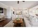 Bright open-concept living room featuring hardwood floors and comfortable seating at 2020 Cotton Barn Ct, Wendell, NC 27591