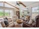 Cozy living room with vaulted ceilings, wood beams, dark wood floors, and comfortable seating arrangement at 2020 Cotton Barn Ct, Wendell, NC 27591