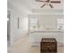 Bright bedroom features tray ceilings, a ceiling fan, and ensuite bathroom access at 2020 Cotton Barn Ct, Wendell, NC 27591