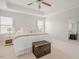 Bright bedroom features tray ceilings, a ceiling fan, and neutral decor at 2020 Cotton Barn Ct, Wendell, NC 27591