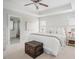 Bright bedroom features tray ceilings, a ceiling fan, and ensuite bathroom access at 2020 Cotton Barn Ct, Wendell, NC 27591