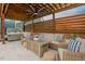 Covered patio with wicker furniture, a coffee table, a hot tub and a ceiling fan provides the perfect spot for outdoor entertaining at 2020 Cotton Barn Ct, Wendell, NC 27591