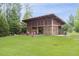 Community pavilion with a fireplace, string lights and lawn, ideal for outdoor gatherings at 2020 Cotton Barn Ct, Wendell, NC 27591