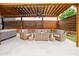 Covered patio with a ceiling fan, hot tub and cozy seating area at 2020 Cotton Barn Ct, Wendell, NC 27591