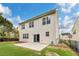 Spacious backyard featuring a well maintained lawn, a walkout concrete patio, and sleek black fence at 213 Florence Dr, Clayton, NC 27527