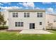 Large backyard with a walkout concrete patio perfect for entertaining, lush lawn, and a sleek black fence at 213 Florence Dr, Clayton, NC 27527