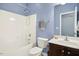 Bathroom featuring a shower-tub combo and vanity with wooden cabinets at 213 Florence Dr, Clayton, NC 27527
