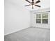 Neutral bedroom with a ceiling fan, carpet and a window providing ample natural light at 213 Florence Dr, Clayton, NC 27527