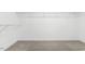 Walk-in closet features neutral carpet and wire shelving for optimal storage and organization at 213 Florence Dr, Clayton, NC 27527