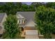 Charming two-story home with brick accents, white siding, manicured landscaping, and an attached two-car garage at 213 Florence Dr, Clayton, NC 27527
