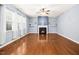 Bright living room with hardwood floors, fireplace, and built-in shelving at 213 Florence Dr, Clayton, NC 27527