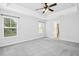 Light-filled main bedroom with plush gray carpet at 213 Florence Dr, Clayton, NC 27527
